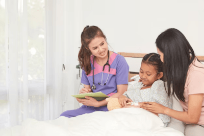 a mother and a nurse taking care of a sick child