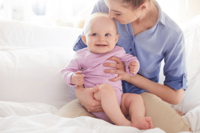 Nurse holding an infant.